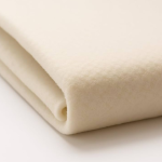 Close-up of folded beige fleece rug underlay showing thickness and soft texture